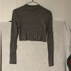 Grey lettuce trimmed long sleeve shirt. Tight fitted, cropped.